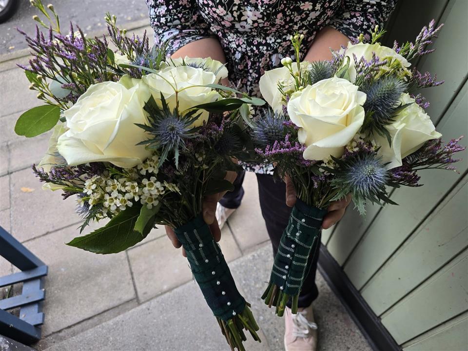 Bridesmaids' bouquets by Flowers by Joan